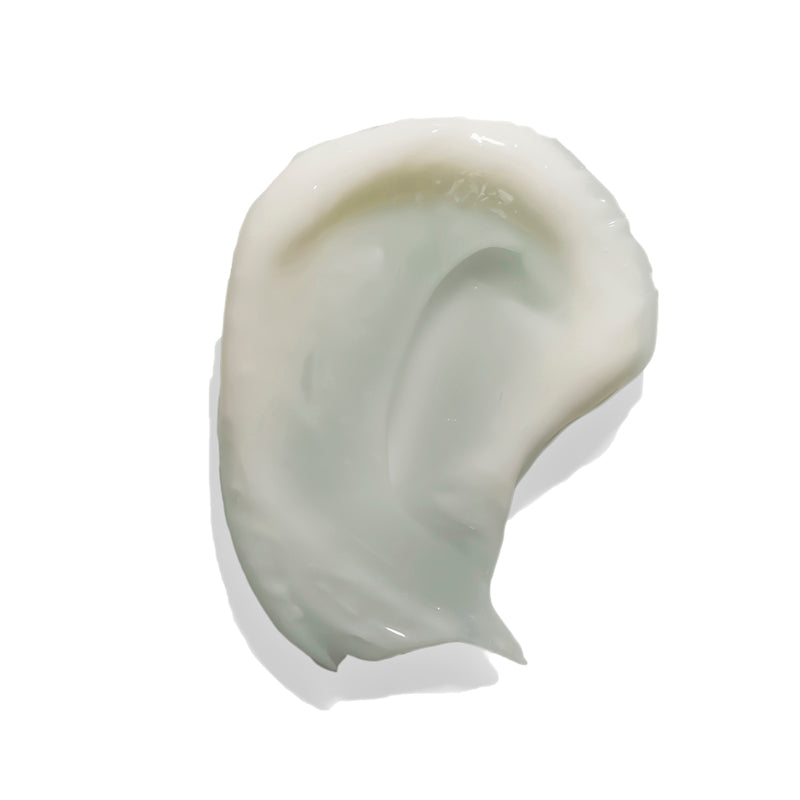 A close-up texture of the Acne Heal Face Cream from Blue Monarch, a face cream for pimples, showcasing its smooth and creamy consistency.